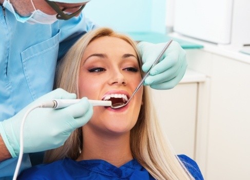 Dentist using intraoral camera to capture smile photos